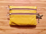 Small purse in MUSTARD YELLOW, genuine leather, closed by 3 zippers. Fits creditcards, coins, bills. YELLOW leather wallet.