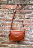 Small leather bag in terracotta - camel brown. Genuine leather cross body / shoulder bag. Adjustable strap, zipper+ flap. Small brown purse