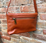 Small leather bag in terracotta - camel brown. Genuine leather cross body / shoulder bag. Adjustable strap, zipper+ flap. Small brown purse