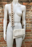 Cream color small leather bag. 2 straps: 1 leather + 1 guitar strap. GENUINE leather Crossbody / shoulder bag. Light beige purse with flap