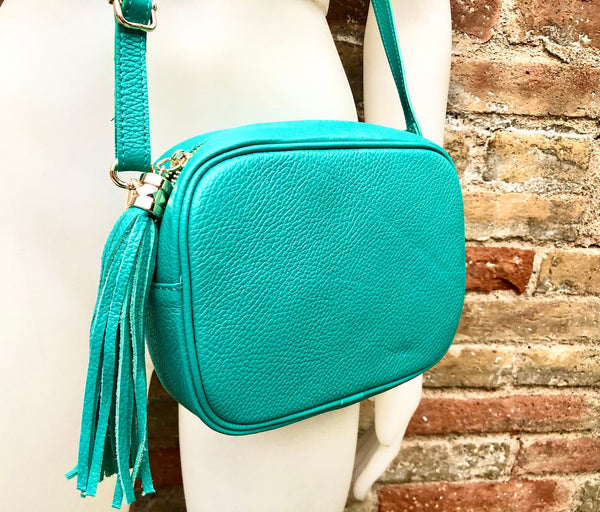small turquoise purse