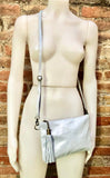 Small leather bag in metallic light silver. Genuine leather cross body / shoulder bag. Silve leather bag with adjustable strap. Silver purse